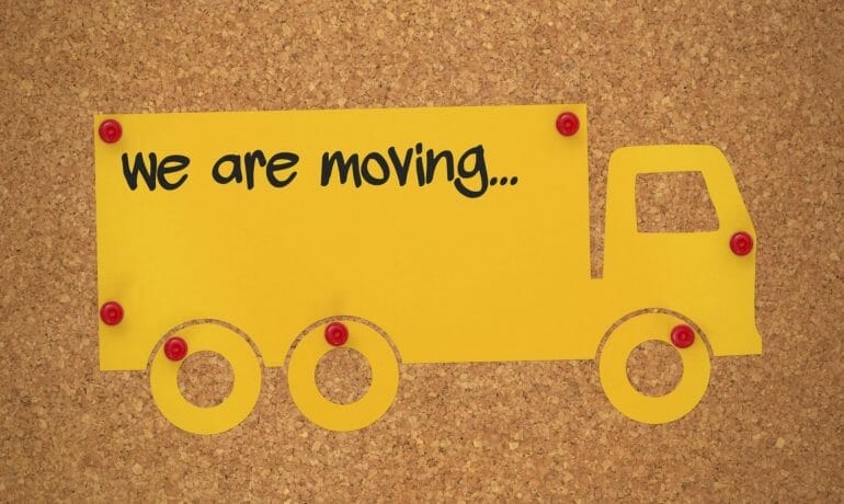 A yellow truck with the words Pediatrics of Sugar Land Clinic Moves.