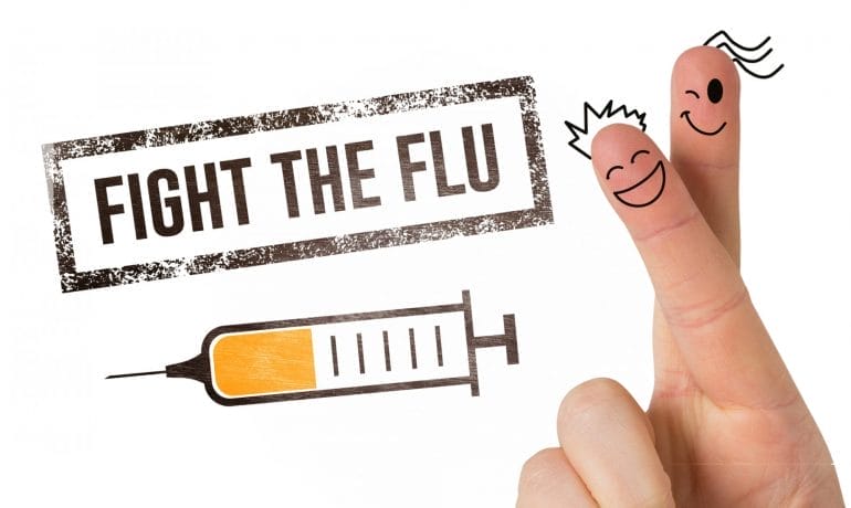 Fight the flu with a hand holding a syringe.
